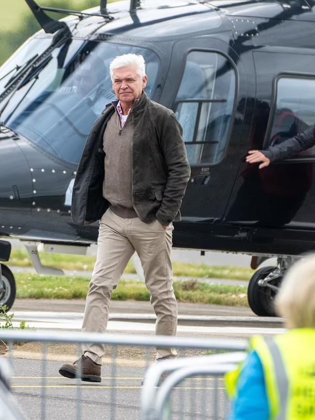 Philip Schofield arrives by helicopter at Silverstone